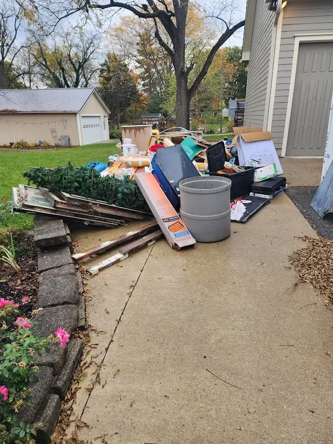 Dumpster being loaded with debris for Commercial Dumpster Rental in Pierre